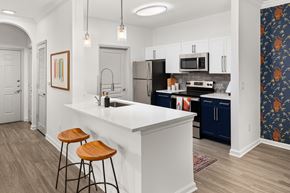 Decatur apartment for rent - a kitchen with an island and two stools