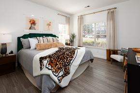 Decatur apartment for rent - a bedroom with a bed with a leopard blanket