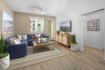 Mountain House apartment for rent - A living room with a blue couch, a coffee table, and a painting on the wall.