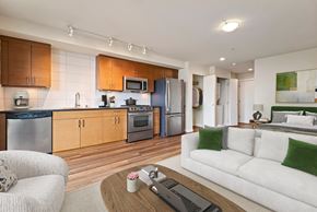Seattle apartment for rent - A modern kitchen with wooden cabinets and stainless steel appliances.