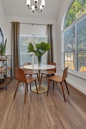 Englewood apartment for rent - A dining room with a round table and chairs.