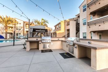 Bbq/picnic area next to a pool