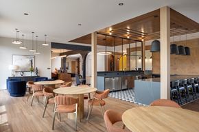 Littleton apartment for rent - A modern dining room with a wooden table and chairs.
