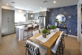 Lathrop apartment for rent - A modern kitchen with a dining table set for two.