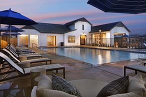 Vacaville apartment for rent - A modern house with a pool in the backyard.