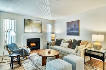 Mesa apartment for rent - a living room with a couch and chairs and a fireplace