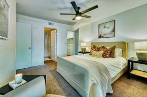 Mesa apartment for rent - a bedroom with a large bed and a ceiling fan