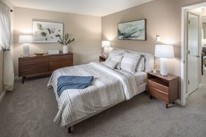Tigard apartment for rent - Bedroom with a bed and two nightstands and a closet at Summerfield, Tigard, OR, 97224