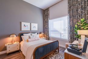 Frisco apartment for rent - bedroom with bed, side table and large window