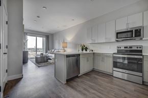 South Salt Lake apartment for rent - a kitchen and living room in a 555 waverly unit