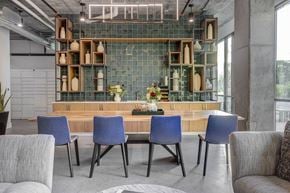 South Salt Lake apartment for rent - a dining room with blue chairs and a wooden table