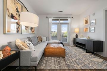 Charlotte apartment for rent - a living room with a gray couch and a