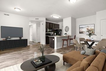 Murray apartment for rent - A living room with a brown couch and a black coffee table.