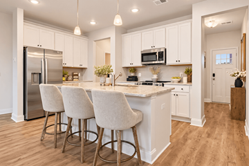 Richmond Hill apartment for rent - A kitchen with white cabinets and a marble countertop.