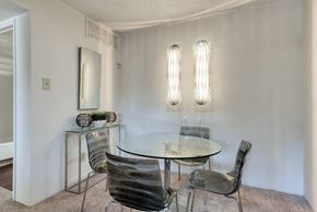 San Antonio apartment for rent - a dining room with a glass table and four chairs