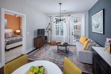 Norcross apartment for rent - A living room with a white table and yellow chairs.