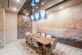 Frisco apartment for rent - meeting room with large table and rolling chairs