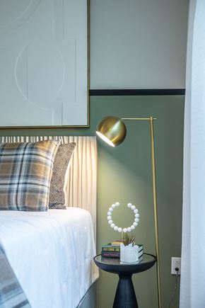 Cary apartment for rent - a bedroom with a bed and a lamp and a table