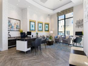 Chula Vista apartment for rent - A modern office space with a desk, chairs, and a large window.
