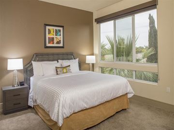 Los Angeles apartment for rent - A bedroom with a large bed and a painting on the wall.