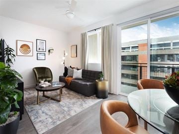 San Diego apartment for rent - a living room with a couch and a table in front of a window