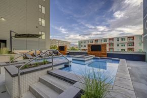 Salt Lake City apartment for rent - apartments with a pool and stairs in front of a building