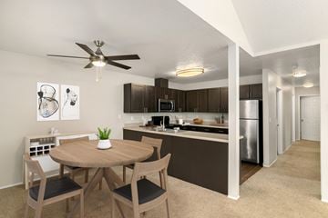 Vancouver apartment for rent - A modern kitchen with a dining table and chairs.