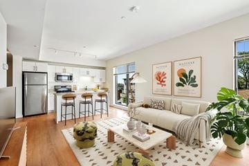 Beverly apartment for rent - A modern living room with a white couch and a coffee table.
