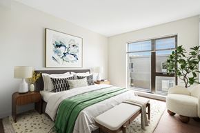 Beverly apartment for rent - A bedroom with a large bed and a painting on the wall.