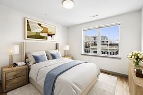 Beverly apartment for rent - A bedroom with a large bed and a painting on the wall.