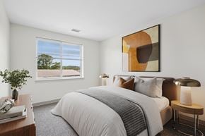 Beverly apartment for rent - A bedroom with a large bed and a painting on the wall.