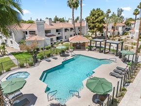 Chandler apartment for rent - Newly renovated community swimming pool with crystal-clear water, upscale lounge seating, and contemporary finishes.