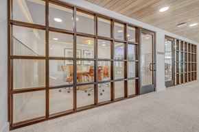 Salt Lake City apartment for rent - a conference room with glass doors and a table in the middle