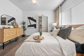 Glendale apartment for rent - A bedroom with a large bed at Cardinal 95 apartments in Glendale.