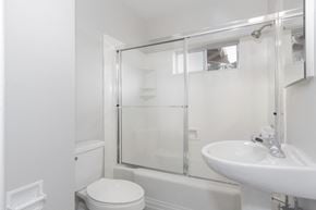 San Leandro apartment for rent - a white bathroom with a shower and a sink