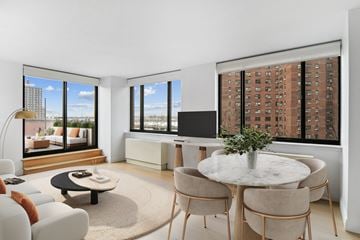 New York apartment for rent - an open living room with a table and chairs and a view of a skyscraper