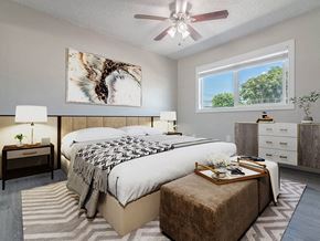 Whittier apartment for rent - a bedroom with a bed and a ceiling fan at Citrus Court Apartments, Whittier
