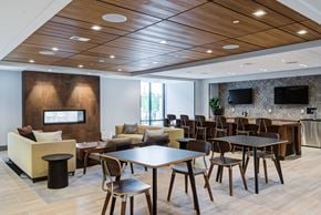 Washington apartment for rent - a dining room with tables and chairs and a fireplace