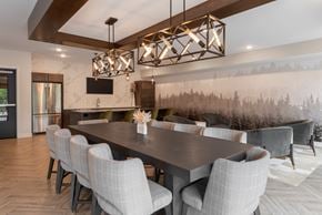 West Saint Paul apartment for rent - A modern dining room with a large table and chairs.