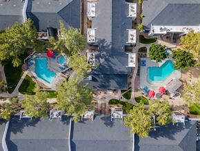 Phoenix apartment for rent - a birds eye view of the resort with pools and trees