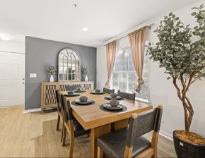 Kennesaw apartment for rent - A dining room with a wooden table and chairs.