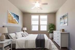 Rohnert Park apartment for rent - a bedroom with a large bed and a ceiling fan