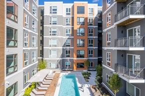 Somerville apartment for rent - an apartment building with a pool in the middle