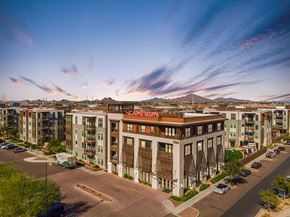 Tempe apartment for rent - A large building with the word "CAMERUN" on it is in the center of a parking lot.