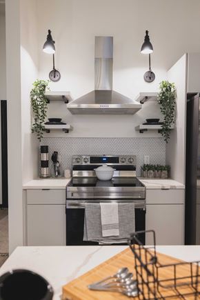 Philadelphia apartment for rent - A modern kitchen with a stove top oven and a hanging herb garden.