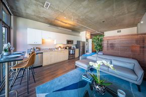 San Diego apartment for rent - A modern kitchen with a dining table and chairs.