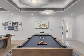 Warwick apartment for rent - A pool table is in the middle of a room with a light hanging from the ceiling.