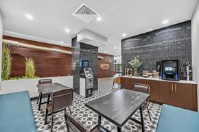 Hackensack apartment for rent - A modern dining area with a black table and chairs.