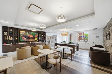 Fort Lee apartment for rent - A modern living room with a dining table and chairs.