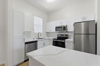 White cabinets with modern countertops